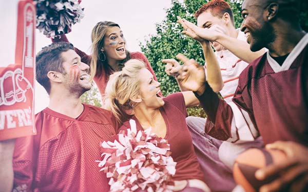 A group of fans wearing sports team apparel